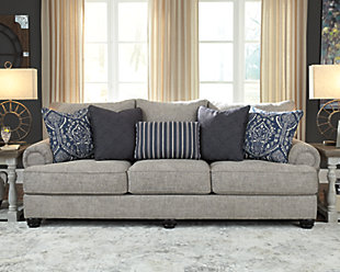 A triumph in transitional design, the Morren sofa invites you to indulge in eye-catching texture and cozy comfort. Flared roll arms and loose, reversible cushions give this classically styled sofa a sense of everyday ease. Soothing blue-hue accent pillows add a wonderful layer of interest.Corner-blocked frame | Loose, reversible cushions | High-resiliency foam cushions wrapped in thick poly fiber | 5 accent pillows included | Polyester upholstery | Polyester; polyester/cotton/rayon; polyester/cotton pillows | Exposed feet with faux wood finish | Platform foundation system resists sagging 3x better than spring system after 20,000 testing cycles by providing more even support | Smooth platform foundation maintains tight, wrinkle-free look without dips or sags that can occur over time with sinuous spring foundations