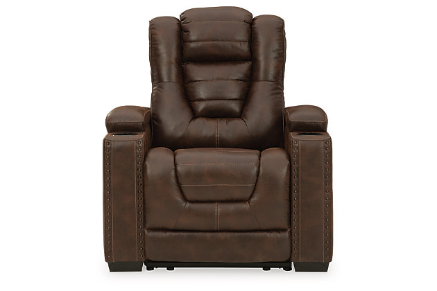When it comes to style, you’ve got game. Rest assured, the Owner’s Box power recliner is sure to win you over with its ultra-cool looks and major league features. Showcasing all the bells and whistles, this designer recliner is inspired by sports car interiors—with a fabulous faux leather accentuated with horizontal channel tufting. An advanced one-touch power control with an Easy View™ power headrest puts you in the driver’s seat. Dual cup holders and armrests with hidden storage take the form and function to another level.One-touch power control with adjustable positions | Easy View™ adjustable headrest | Corner-blocked frame with metal reinforced seat | Attached cushions | High-resiliency foam cushions wrapped in thick poly fiber | Faux leather upholstery | Each armrest includes storage compartment and cup holder | Extended ottoman for enhanced comfort | Power cord included; UL Listed | Exposed feet with faux wood finish | Estimated Assembly Time: 15 Minutes