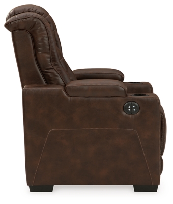 When it comes to style, you’ve got game. Rest assured, the Owner’s Box power recliner is sure to win you over with its ultra-cool looks and major league features. Showcasing all the bells and whistles, this designer recliner is inspired by sports car interiors—with a fabulous faux leather accentuated with horizontal channel tufting. An advanced one-touch power control with an Easy View™ power headrest puts you in the driver’s seat. Dual cup holders and armrests with hidden storage take the form and function to another level.One-touch power control with adjustable positions | Easy View™ adjustable headrest | Corner-blocked frame with metal reinforced seat | Attached cushions | High-resiliency foam cushions wrapped in thick poly fiber | Faux leather upholstery | Each armrest includes storage compartment and cup holder | Extended ottoman for enhanced comfort | Power cord included; UL Listed | Exposed feet with faux wood finish | Estimated Assembly Time: 15 Minutes