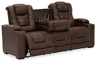 When it comes to style, you’ve got game. Rest assured, the Owner’s Box power reclining sofa is sure to win you over with its ultra-cool looks and major league features. Showcasing all the bells and whistles, this designer reclining sofa is inspired by sports car interiors—with a fabulous faux leather accentuated with horizonal channel tufting. An advanced one-touch power control with an Easy View™ power headrest puts you in the driver’s seat. Dual cup holders and armrests with hidden storage take the form and function to another level, while a middle seat with drop-down table, cup holders and docking station cater to your every want and need.Dual-sided recliner | One-touch power control with adjustable positions | Easy View™ adjustable headrest | Corner-blocked frame with metal reinforced seat | Attached cushions | High-resiliency foam cushions wrapped in thick poly fiber | Faux leather upholstery | Each armrest includes storage compartment and cup holder | Extended ottoman for enhanced comfort | Drop down table with 2 cup holders plus A/C power and USB ports for charging electronics | Power cord included; UL Listed | Exposed feet with faux wood finish | Estimated Assembly Time: 15 Minutes