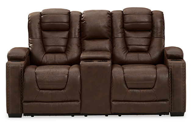 When it comes to style, you’ve got game. Rest assured, the Owner’s Box power reclining loveseat is sure to win you over with its ultra-cool looks and major league features. Showcasing all the bells and whistles, this designer reclining loveseat is inspired by sports car interiors—with a fabulous faux leather accentuated with horizonal channel tufting. An advanced one-touch power control with an Easy View™ power headrest puts you in the driver’s seat. On top of a cup holder and hidden storage on each armrest, you’ve got a center console with two more cup holders and storage for remotes and more.Dual-sided recliner | One-touch power control with adjustable positions | Easy View™ adjustable headrest | Corner-blocked frame with metal reinforced seat | Attached cushions | High-resiliency foam cushions wrapped in thick poly fiber | Faux leather upholstery | Each armrest includes storage compartment and cup holder | Extended ottoman for enhanced comfort | Center console with 2 cup holders and hidden storage | Power cord included; UL Listed | Exposed feet with faux wood finish | Estimated Assembly Time: 15 Minutes
