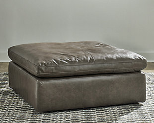 Talk about keeping it real. Wrapped in genuine leather for an incomparable feel, the clean-lined and contemporary Alabonson ottoman indulges you with luxury at such an enticing price. As if its all-leather upholstery wasn’t enough, this designer ottoman tantalizes with a thick cushion filled with a special feather-fiber blend which encases a foam core for pillowy plushness. And the distressed concrete gray leather? Perfect for a cool, kicked-back vibe.
Corner-blocked frame | Firmly cushioned | Cushion with feather/fiber blend encasing a foam core | Leather upholstery | Distressed concrete gray is right on trend