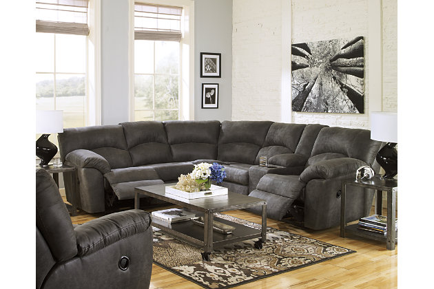With plush cushions and wraparound pillow top arms, the Tambo sectional takes comfort to a whole new level. Faux vintage leather requires minimal care, making this relaxation station ideal in homes with children and pets. Reclining feature engages with the pull of a tab, putting pleasure at your fingertips.Includes 2 pieces: left-arm facing reclining loveseat and right-arm facing reclining loveseat | "Left-arm" and "right-arm" describe the position of the arm when you face the piece | Pull tab reclining motion | Dual-sided recliners; right-arm facing loveseat with center storage console and 2 cup holders | Corner-blocked frame with metal reinforced seats | High-resiliency foam cushions wrapped in thick poly fiber | Polyester/polyurethane upholstery | Estimated Assembly Time: 5 Minutes