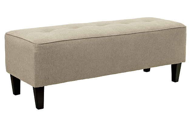 Sinko ottoman’s long length allows you to stretch its possibilities. Flank a sofa and enjoy kicking up your heels in sophisticated style. Or give that entryway a long-awaited finishing touch.Firmly cushioned | Nylon/polyester upholstery with button tufting | Exposed feet with faux wood finish | High-resiliency foam cushion wrapped in thick poly fiber | Corner-blocked frame | Assembly required | Excluded from promotional discounts and coupons