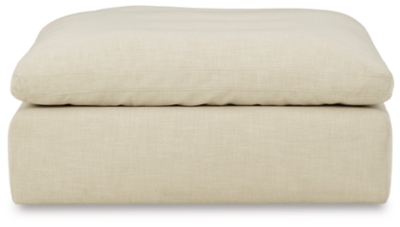 Blending a fresh, clean aesthetic with cloud-like comfort that’s impossible to resist, the Tanavi ottoman sets the scene for living the dream. Whether your look is warm and cozy modern farmhouse or cool, crisp and contemporary, this masterfully crafted square ottoman tantalizes with a feather/fiber blend cushion with pillowy plushness and a linen-like fabric that’s a breath of fresh air.Corner-blocked frame | Attached cushioned top | Cushion with feather/fiber blend encasing a foam core | Polyester upholstery | Perfect for a modern farmhouse or contemorary aesthetic