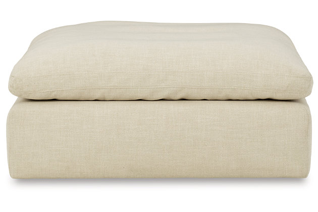 Blending a fresh, clean aesthetic with cloud-like comfort that’s impossible to resist, the Tanavi ottoman sets the scene for living the dream. Whether your look is warm and cozy modern farmhouse or cool, crisp and contemporary, this masterfully crafted square ottoman tantalizes with a feather/fiber blend cushion with pillowy plushness and a linen-like fabric that’s a breath of fresh air.Corner-blocked frame | Attached cushioned top | Cushion with feather/fiber blend encasing a foam core | Polyester upholstery | Perfect for a modern farmhouse or contemorary aesthetic