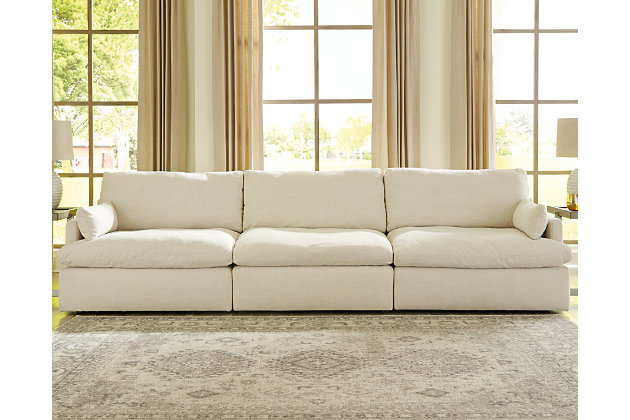 Blending a fresh, clean aesthetic with cloud-like comfort that’s impossible to resist, the Tanavi sofa sets the scene for living the dream. Whether your look is warm and cozy modern farmhouse or cool, crisp and contemporary, this masterfully crafted modular sofa tantalizes, with feather-fiber blend reversible cushions with pillowy plushness and a linen-like fabric that’s a breath of fresh air. Slim track arms and structural bolster pillows enhance the experience.Includes armless chair, left-arm facing corner chair and right-arm facing corner chair | "Left-arm" and "right-arm" describe the position of the arm when you face the piece | Modular pieces can float anywhere; sides are finished (with no connectors)  | Corner-blocked frame | Reversible seat/back cushions | Seat cushions with feather-fiber blend encasing a foam core | Polyester upholstery | Bolster pillows included | Platform foundation system resists sagging 3x better than spring system after 20,000 testing cycles by providing more even support | Smooth platform foundation maintains tight, wrinkle-free look without dips or sags that can occur over time with sinuous spring foundations | Estimated Assembly Time: 10 Minutes