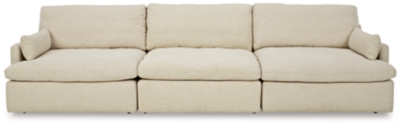 Blending a fresh, clean aesthetic with cloud-like comfort that’s impossible to resist, the Tanavi sofa sets the scene for living the dream. Whether your look is warm and cozy modern farmhouse or cool, crisp and contemporary, this masterfully crafted modular sofa tantalizes, with feather/fiber blend reversible cushions with pillowy plushness and a linen-like fabric that’s a breath of fresh air. Slim track arms and structural bolster pillows enhance the experience.Includes 3 pieces: armless chair, left-arm facing corner chair and right-arm facing corner chair | "Left-arm" and "right-arm" describe the position of the arm when you face the piece | Corner-blocked frame | Reversible seat/back cushions | Seat cushions with feather/fiber blend encasing a foam core | Polyester upholstery | Bolster pillows included | Platform foundation system resists sagging 3x better than spring system after 20,000 testing cycles by providing more even support | Smooth platform foundation maintains tight, wrinkle-free look without dips or sags that can occur over time with sinuous spring foundations | Estimated Assembly Time: 10 Minutes