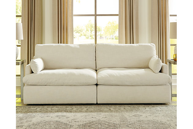 Blending a fresh, clean aesthetic with cloud-like comfort that’s impossible to resist, the Tanavi loveseat sets the scene for living the dream. Whether your look is warm and cozy modern farmhouse or cool, crisp and contemporary, this masterfully crafted modular loveseat tantalizes with feather/fiber blend reversible cushions with pillowy plushness and a linen-like fabric that’s a breath of fresh air. Slim track arms and structural bolster pillows enhance the experience.Includes 2 pieces: left-arm facing corner chair and right-arm facing corner chair | "Left-arm" and "right-arm" describe the position of the arm when you face the piece | Corner-blocked frame | Reversible seat/back cushions | Seat cushions with feather/fiber blend encasing a foam core | Polyester upholstery | Bolster pillows included | Platform foundation system resists sagging 3x better than spring system after 20,000 testing cycles by providing more even support | Smooth platform foundation maintains tight, wrinkle-free look without dips or sags that can occur over time with sinuous spring foundations | Estimated Assembly Time: 5 Minutes