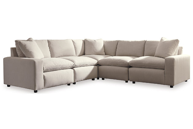 Looking comfortable. Feeling comfortable. That’s what modern farmhouse living is all about. What better way to embrace the modern farmhouse trend than with the Savesto sectional sofa in ivory white. As casually cool as they are luxurious, the sectional’s reversible back and seat cushions are feather filled and wrapped in a cottony soft fabric for cloud-like comfort. Crisp, clean lines and track arm styling simply work.Includes 5 pieces: 2 armless chairs, left-arm facing corner chair, right-arm facing corner chair and wedge | "Left-arm" and "right-arm" describe the position of the arm when you face the piece | Corner-block frame | Loose feather-blend cushions | 3 toss pillows included | Pillows with feather-blend inserts | Polyester upholstery and pillows | Exposed feet with faux wood finish | Estimated Assembly Time: 15 Minutes