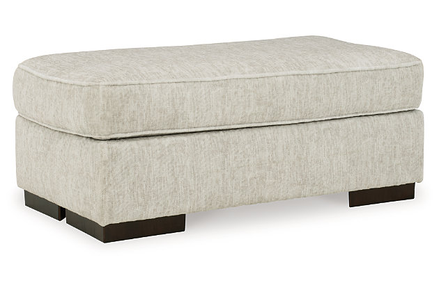 Decidedly modern with a sense of relaxed ease, the Alesandra ottoman looks at home in so many different places and spaces. Sporting a subtle chevron texture, the parchment-tone upholstery takes neutral to new heights. Providing a highly distinctive look: low-to-the-floor block feet in a warm wood-tone finish.Corner-blocked frame | Firmly cushioned | High-resiliency foam cushion wrapped in thick poly fiber | Polyester upholstery | Exposed feet with faux wood finish