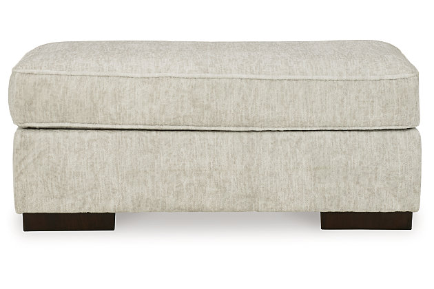 Decidedly modern with a sense of relaxed ease, the Alesandra ottoman looks at home in so many different places and spaces. Sporting a subtle chevron texture, the parchment-tone upholstery takes neutral to new heights. Providing a highly distinctive look: low-to-the-floor block feet in a warm wood-tone finish.Corner-blocked frame | Firmly cushioned | High-resiliency foam cushion wrapped in thick poly fiber | Polyester upholstery | Exposed feet with faux wood finish