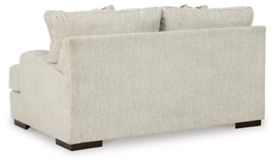 Decidedly modern with a sense of relaxed ease, the Alesandra loveseat looks at home in so many different places and spaces. Providing a highly distinctive look: substantial track arms with curved cornering, wrapped t-cushions and low-to-the-floor block feet in a warm wood-tone finish. Sporting a subtle chevron texture, the parchment-tone upholstery takes neutral to new heights.Corner-blocked frame | Loose back and reversible seat cushions | High-resiliency foam cushions wrapped in thick poly fiber | Polyester upholstery | Throw pillows included | Pillows with soft polyfill | Exposed feet with faux wood finish | Platform foundation system resists sagging 3x better than spring system after 20,000 testing cycles by providing more even support | Smooth platform foundation maintains tight, wrinkle-free look without dips or sags that can occur over time with sinuous spring foundations