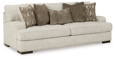 Decidedly modern with a sense of relaxed ease, the Alesandra sofa looks at home in so many different places and spaces. Providing a highly distinctive look: substantial track arms with curved cornering, wrapped t-cushions and low-to-the-floor block feet in a warm wood-tone finish. Sporting a subtle chevron texture, the parchment-tone upholstery takes neutral to new heights.Corner-blocked frame | Reversible back and seat cushions | High-resiliency foam cushions wrapped in thick poly fiber | Polyester upholstery | Throw pillows included | Pillows with soft polyfill | Exposed feet with faux wood finish | Platform foundation system resists sagging 3x better than spring system after 20,000 testing cycles by providing more even support | Smooth platform foundation maintains tight, wrinkle-free look without dips or sags that can occur over time with sinuous spring foundations