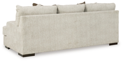 Decidedly modern with a sense of relaxed ease, the Alesandra sofa looks at home in so many different places and spaces. Providing a highly distinctive look: substantial track arms with curved cornering, wrapped t-cushions and low-to-the-floor block feet in a warm wood-tone finish. Sporting a subtle chevron texture, the parchment-tone upholstery takes neutral to new heights.Corner-blocked frame | Reversible back and seat cushions | High-resiliency foam cushions wrapped in thick poly fiber | Polyester upholstery | Throw pillows included | Pillows with soft polyfill | Exposed feet with faux wood finish | Platform foundation system resists sagging 3x better than spring system after 20,000 testing cycles by providing more even support | Smooth platform foundation maintains tight, wrinkle-free look without dips or sags that can occur over time with sinuous spring foundations