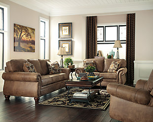 Dramatically transform your living space with the rustic look of weathered leather you love—at a fraction of the cost. That’s the beauty of the Larkinhurst faux leather loveseat. Washed in earthy Southwestern tones, with generous back and seating support and jumbo window-pane stitching, it envelops you in comfort and quality. Classic elements such as roll arms and turned feet bring in just enough traditional touch.Corner-blocked frame | Attached back and loose seat cushions | Cushions with ultra-supportive, pocketed coils | 2 decorative pillows included | Pillows with soft feather inserts; zippered access | Polyester/polyurethane upholstery; polyester/polyurethane and polyester pillows | Nailhead trim | Exposed feet with faux wood finish