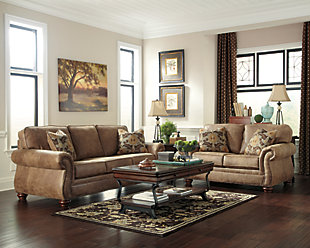 Dramatically transform your living space with the rustic look of weathered leather you love—at a fraction of the cost. That’s the beauty of the Larkinhurst faux leather furniture set with sofa and loveseat. Washed in earthy Southwestern tones, with generous back and seating support and jumbo window-pane stitching—it envelops you in comfort and quality. Classic elements such as roll arms and turned feet bring in just enough traditional touch.Includes sofa and loveseat | Corner-blocked frame | Attached back and loose seat cushions | Cushions with ultra-supportive, pocketed coils | 4 decorative pillows included | Pillows with soft feather inserts; zippered access | Polyester/polyurethane upholstery; polyester/polyurethane and polyester pillows | Nailhead trim | Nailhead trim