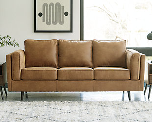 The Maimz sofa is mid-century revival done to perfection. Linear and minimalistic, the beautifully edited profile has all the retro elements you love, like sheltering arms, bolster pillows and tapered splayed legs. So casually cool, the caramel faux leather upholstery brings the look right into the present.Corner-blocked frame | Reversible back and seat cushions | High-resiliency foam cushions wrapped in thick poly fiber | Polyester/polyurethane (faux leather) upholstery | Attached arm bolster pillows | Pillows with soft polyfill | Tapered splayed legs | Platform foundation system resists sagging 3x better than spring system after 20,000 testing cycles by providing more even support | Smooth platform foundation maintains tight, wrinkle-free look without dips or sags that can occur over time with sinuous spring foundations
