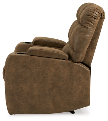 Whether it's Friday movie nights or Sunday afternoon football that moves you, the Kennebec biscuit back power recliner makes it all that much more enticing from the comfort of your abode. Plushly padded in all the right places, rich brown upholstery is pure delight.Brown upholstery | Hidden storage armrest with cup holder | Power reclining mechanism | Power cord included | Estimated Assembly Time: 15 Minutes