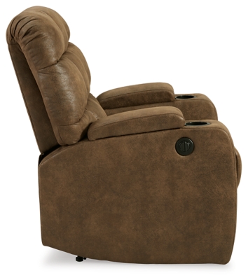 Whether it's Friday movie nights or Sunday afternoon football that moves you, the Kennebec biscuit back power recliner makes it all that much more enticing from the comfort of your abode. Plushly padded in all the right places, rich brown upholstery is pure delight.Brown upholstery | Hidden storage armrest with cup holder | Power reclining mechanism | Power cord included | Estimated Assembly Time: 15 Minutes