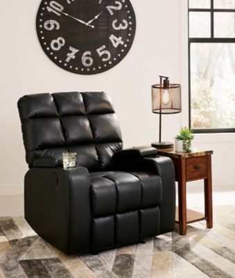 Whether it's Friday movie nights or Sunday afternoon football that moves you, the Kennebec biscuit back power recliner makes it all that much more enticing from the comfort of your abode. Plushly padded in all the right places, striking black upholstery is pure delight.Power recliner | Black upholstery | Power reclining mechanism | Hidden storage armrest with cup holder | Estimated Assembly Time: 15 Minutes