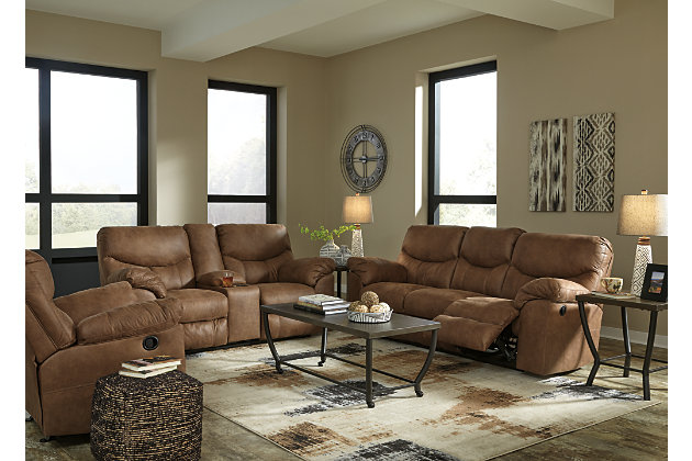 Rock the cool look of leather minus the hefty price tag with the Boxberg reclining sofa. Rich with tonal variation, the indulgently soft upholstery sure looks like the real thing. And talk about indulgent comfort. Double stuffed armrests and sumptuous cushions cradle and support in all the right places. Distinctive scooped stitching enhances this reclining sofa’s contemporary flair.Dual-sided recliner; middle seat remains stationary | Pull tab reclining motion | Corner-blocked frame with metal reinforced seat | Attached cushions | High-resiliency foam cushions wrapped in thick poly fiber | Polyester/polyurethane upholstery | Excluded from promotional discounts and coupons