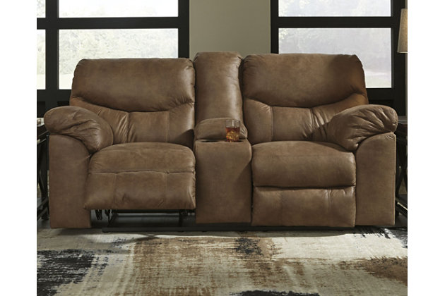 Rock the cool look of leather minus the hefty price tag with the Boxberg power reclining loveseat with console. Rich with tonal variation, the indulgently soft upholstery sure looks like the real thing. And talk about indulgent comfort. Double stuffed armrests and sumptuous cushions cradle and support in all the right places. Distinctive scooped stitching enhances this reclining loveseat’s contemporary flair. Cup holders and hidden storage complete the experience.Dual-sided recliner | One-touch power control with adjustable positions | Corner-blocked frame with metal reinforced seat | Attached cushions | High-resiliency foam cushions wrapped in thick poly fiber | Polyester/polyurethane upholstery | Lift-top console with 2 cup holders | Power cord included; UL listed | Excluded from promotional discounts and coupons