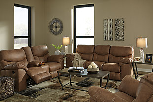 Rock the cool look of leather minus the hefty price tag with the Boxberg power reclining sofa. Rich with tonal variation, the indulgently soft upholstery sure looks like the real thing. And talk about indulgent comfort. Double stuffed armrests and sumptuous cushions cradle and support in all the right places. Distinctive scooped stitching enhances this reclining sofa’s contemporary flair.Dual-sided recliner; middle seat remains stationary | One-touch power control with adjustable positions | Corner-blocked frame with metal reinforced seat | Attached cushions | High-resiliency foam cushions wrapped in thick poly fiber | Polyester/polyurethane upholstery | Power cord included; UL listed | Excluded from promotional discounts and coupons