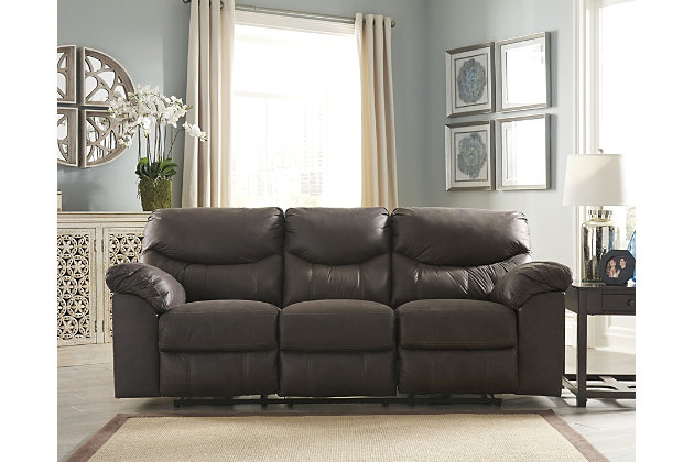 Rock the cool look of leather minus the hefty price tag with the Boxberg power reclining sofa. Rich with tonal variation, the indulgently soft upholstery sure looks like the real thing. And talk about indulgent comfort. Double stuffed armrests and sumptuous cushions cradle and support in all the right places. Distinctive scooped stitching enhances this reclining sofa’s contemporary flair.Dual-sided recliner; middle seat remains stationary | One-touch power control with adjustable positions | Corner-blocked frame with metal reinforced seat | Attached cushions | High-resiliency foam cushions wrapped in thick poly fiber | Polyester/polyurethane upholstery | Power cord included; UL listed | Estimated Assembly Time: 15 Minutes