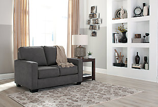 What a fresh awakening in minimalist design. Striking a highly linear pose with track arms and crisp box cushions, the Zeb twin sofa sleeper is beautiful proof that less is more. Wrapped in a richly neutral microfiber upholstery, Zeb includes an upgraded memory foam mattress to make your overnight guests that much more comfortable.Corner-blocked frame | Attached back and loose seat cushions | High-resiliency foam cushions wrapped in thick poly fiber | Polyester/nylon upholstery | Exposed feet with faux wood finish | Included bi-fold twin memory foam mattress sits atop a supportive steel frame | Memory foam provides better airflow for a cooler night’s sleep | Memory foam encased in damask ticking | Excluded from promotional discounts and coupons