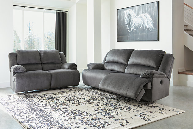 Large-scale comfort is yours with the Clonmel 2-seat reclining power sofa. With supremely padded back, seat and arm cushions, it's the hero for ultimate relaxation. Microfiber upholstery is welcoming, soft and luxuriously covers the extra-wide seats. Recline back and kick up your feet to bolster your comfort level even more.Polyester microfiber upholstery | Dual-sided recliner | Corner-blocked frame with metal reinforced seats | Attached backs and seat cushions | One-touch power controls with adjustable positions | High-resiliency foam cushions wrapped in thick poly fiber | Power cord included; UL Listed | Estimated Assembly Time: 15 Minutes
