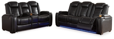 The Party Time power reclining sofa takes its cue from luxury automobiles with lattice- and cross-hatch stitching, for a richly tailored aesthetic that gives you plenty of reasons to celebrate. Sumptuously padded cushions and dramatic midnight black faux leather upholstery add to the indulgence. When it’s time to rev up the action, the sofa’s dual reclining bucket seats (middle seat is stationary), Easy View™ power adjustable headrests and center seat that folds down into a table keep you in the driver’s seat. Ambient blue LED lighting on the base and cup holders completes the theater-style experience.Dual-sided recliner | Polyester/polyurethane upholstery | Corner-blocked frame with metal reinforced seats | Attached backs and seat cushions | High-resiliency foam cushions wrapped in thick poly fiber | One-touch power controls with adjustable positions | Easy View™ power adjustable headrests | Flip up padded armrests with hidden storage underneath | Drop down table with 2 cup holders and a handy docking station for charging electronics | Includes USB charging port in each power control | Flip up LED light (under center seat headrest) | LED lighting on the base and cup holders for theater-style experience | Power cord included; UL Listed | Estimated Assembly Time: 15 Minutes