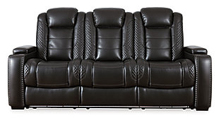The Party Time power sofa takes its cue from luxury automobiles with lattice- and cross-hatch stitching, for a richly tailored aesthetic that gives you plenty of reasons to celebrate. Sumptuously padded cushions and dramatic midnight black faux leather upholstery add to the indulgence. When it’s time to rev up the action, the sofa’s dual reclining bucket seats (middle seat stays stationary), Easy View™ power adjustable headrests, LED accent lighting and center seat that folds down into a table keep you in the driver’s seat.Dual-sided recliner | Polyester/polyurethane upholstery | Corner-blocked frame with metal reinforced seats | Attached backs and seat cushions | High-resiliency foam cushions wrapped in thick poly fiber | One-touch power controls with adjustable positions | Easy View™ power adjustable headrests | LED lighted cup holders; flip up padded armrests with hidden storage underneath | Drop down table with 2 cup holders and a handy docking station for charging electronics | Includes USB charging port in each power control | Flip up LED light (under center seat headrest) | Underneath LED lighting | Power cord included; UL Listed | Estimated Assembly Time: 15 Minutes