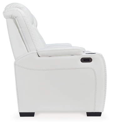 The Party Time power reclining loveseat takes its cue from luxury automobiles with lattice and crosshatch stitching, for a richly tailored aesthetic that gives you plenty of reasons to celebrate. Sumptuously padded cushions and crisp white faux leather upholstery add to the indulgence. When it’s time to rev up the action, the dual reclining bucket seats, Easy View™ power adjustable headrests and center console with docking station keep you in the driver’s seat. Dual-sided recliner | Polyester/polyurethane upholstery | Corner-blocked frame with metal reinforced seat | Attached back and seat cushions | High-resiliency foam cushions wrapped in thick poly fiber | One-touch power control with adjustable positions, Easy View™ adjustable headrest and USB plug-in | Flip up padded armrests with hidden storage | Center console with cup holders and underneath storage | Ambient blue LED lighting on cup holders and base for a theater-style experience | Power cord included; UL Listed | Estimated Assembly Time: 15 Minutes