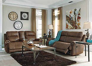 The Austere reclining sofa lives up to its name—if we’re talking sparing that "puffy" look you might expect from a recliner. When it comes to contemporary style, it doesn't hold back. Subtle touches such as sporty jumbo stitching, nailhead trim and a "weather worn" effect on the upholstery give this handsome piece a buttoned-up appeal and fresh feel.Dual-sided recliner | Pull tab reclining motion | Corner-blocked frame with metal reinforced seat | Attached back and seat cushions | High-resiliency foam cushions wrapped in thick poly fiber | Polyester/polyurethane upholstery | Nailhead trim with antiqued goldtone finish | Excluded from promotional discounts and coupons