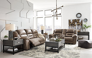 For those that love the cool look of leather but long for the warm feel of fabric, the Stoneland reclining sofa delivers both with ease. Its high-performance padded faux leather is remarkably durable and easy to clean, just the thing for family spaces. Channel-stitched back cushions provide indulgent lumbar support for maximum comfort—not to mention fashion-forward flair.Dual-sided recliner; middle seat remains stationary | Corner-blocked frame with metal reinforced seats | Tab pull reclining motion | Attached cushions | High-resiliency foam cushions wrapped in thick poly fiber | Polyester/polyurethane (faux leather) upholstery | Estimated Assembly Time: 15 Minutes