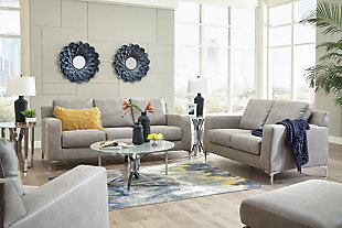 What a pleasant surprise: high-end luxury made comfortably affordable. That’s what makes the Ryler faux leather sofa in steel gray so alluring. Made exclusively for those wanting to make a designer statement, this finely crafted sofa is dressed to impress with crisp, clean styling, sumptuous cushioning and a fabulous fabric that looks like cool weathered leather but entices with a warm, indulgent feel.Corner-blocked frame | Loose back and seat cushions | High-resiliency foam cushions wrapped in thick poly fiber | Polyester/polyurethane (faux leather) upholstery | Exposed metal feet with chrome-tone finish | Excluded from promotional discounts and coupons | Platform foundation system resists sagging 3x better than spring system after 20,000 testing cycles by providing more even support | Smooth platform foundation maintains tight, wrinkle-free look without dips or sags that can occur over time with sinuous spring foundations