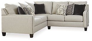 The forecast calls for high-style living. Sporting a fog-hued, tweed-weave fabric in a light and lovely shade of gray, the Hallenburg sectional is sure to lift your spirits and elevate your style. The sectional’s clean-lined profile and crisp, track arms are punctuated with black nickel-tone nailhead trim that adds so much panache. Seven heavenly toss pillows showcase the beauty of black all the more.Includes 2 pieces: left-arm facing sofa with corner wedge and right-arm loveseat | "Left-arm" and "right-arm" describe the position of the arm when you face the piece | Corner-blocked frame | Attached back and loose seat cushions | High-resiliency foam cushions wrapped in thick poly fiber | 7 accent pillows included | Pillows with soft polyfill | Polyester upholstery and pillows | Nailhead trim | Exposed feet with faux wood finish | Estimated Assembly Time: 35 Minutes