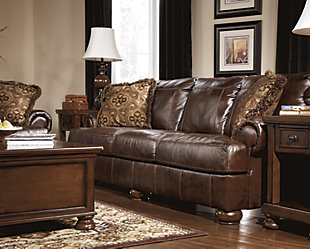 The classic look of natural, weatherworn leather. Fall in love with how well it fits into your design scheme with the Axiom sofa. It’s upholstered in rich leather for that buttery soft feel and rustic appeal. Plush rolled arms and high-character details such as box-stitched cushions and detailed bun feet beautifully evoke casual charm.Corner-blocked frame | Attached back and loose seat cushions | UltraPlush cushions remain loftier longer | 2 layers of cushioned comfort: High-density foam core encased in thick polyfill | 2 accent pillows included | Pillows with soft polyfill | Polyester/rayon; polyester/polypropylene pillows | Genuine leather upholstery | Exposed feet with faux wood finish