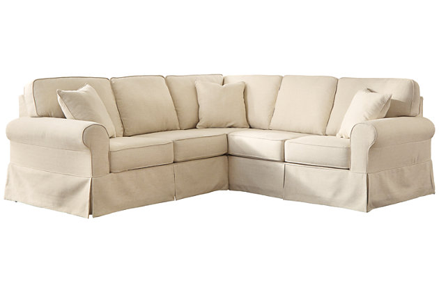 A fresh choice for modern farmhouse styling, the 2-piece Shermyla sectional is sure to make your home on the grange that much more warm and welcoming. Cream-colored upholstery, flirty skirt tailoring and reversible cushions enhance the easy-breezy aesthetic.Includes 2 pieces: right-arm facing sofa with corner wedge and left-arm facing loveseat | "Left-arm" and "right-arm" describe the position of the arm when you face the piece | Corner-blocked frame | Reversible cushions | High-resiliency foam cushions wrapped in thick poly fiber | 3 accent pillows included | Pillows with soft polyfill | Polyester upholstery and pillows | Fabric skirt over faux wood finished feet | Excluded from promotional discounts and coupons | Estimated Assembly Time: 5 Minutes