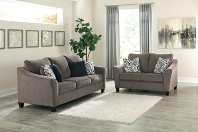 The Nemoli queen sofa sleeper sets the scene for a modern space full of casual flair. Its textured chenille with solid microfiber upholstery provides a luxuriously soft feel that’s inviting. Gently flared arms and plush seat cushions welcome comfort and relaxation. The on-trend slate-colored upholstery offers a perfect background for the four decorative pillows to pop with beauty. Pull-out queen mattress in quality memory foam comfortably accommodates overnight guests.Polyester/textured chenille with solid microfiber upholstery | High-resiliency foam cushions wrapped in thick poly fiber | Corner-blocked frame | Exposed tapered feet | Loose back and seat cushions; non-reversible | Included bi-fold queen memory foam mattress sits atop a supportive steel frame | Memory foam provides better airflow for a cooler night’s sleep | Includes 2 button-tufted pillows and 2 accent pillows made of polyester fabric