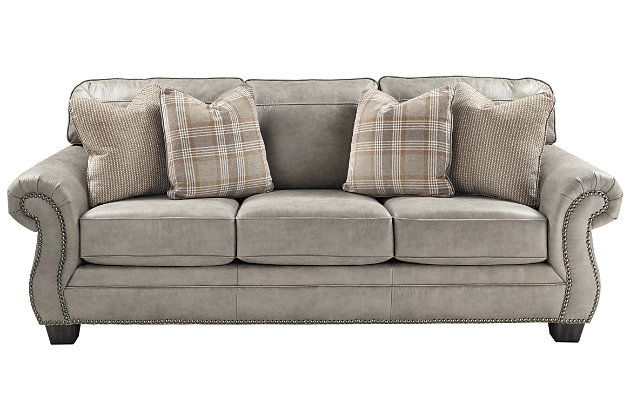 Seamlessly merging classic elements with modern trends, the Olsberg sofa sleeper invites you to bring home the best of then and now. Wrapped in a fabulous steel gray upholstery with sumptuous suede-like feel, this easy-elegant sofa sleeper is dressed to impress with updated roll arm styling and tailored touches including nailhead trim and window pane stitching. What you can’t see is every bit as impressive. Reversible seat cushions crafted with our highest quality coils provide a bit of bounce and plenty of comfort and support. Queen pull-out mattress with quality memory foam accommodates overnight guests.Corner-blocked frame | Attached back and loose cushions | Seat cushions with ultra-supportive, pocketed coils | 4 accent pillows included | Pillows with soft feather inserts; zippered access | Polyester/polyurethane upholstery; polyester and polyester/polyurethane pillows | Nailhead trim | Exposed feet with faux wood finish | Included bi-fold queen memory foam mattress sits atop a supportive steel frame | Memory foam provides better airflow for a cooler night’s sleep | Memory foam encased in damask ticking