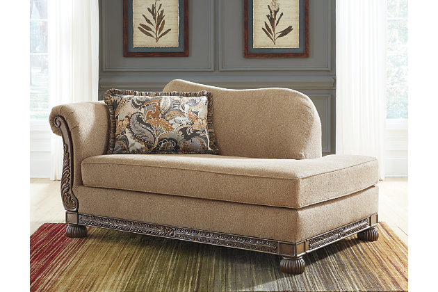 The Westerwood left-arm facing chaise takes traditional style in a new direction. Loaded with flair, the dark-finished exposed frame with artful detailing has us yearning for yesteryear. Wrapped in a richly neutral chenille upholstery and complemented with a jacquard paisley pillow, this instant classic chaise takes the past right into the present.Corner-blocked frame | Attached back and loose seat cushions | High-resiliency foam cushions wrapped in thick poly fiber | Decorative pillow included | Pillow with soft polyfill | Polyester upholstery | Polyester; polyester/rayon pillow | Exposed feet and frame with faux wood finish