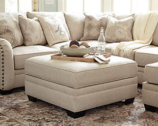 Stow in love. Luxora ottoman with storage has you covered in more ways than one. Its ample scale makes it abundantly luxurious—leaving plenty of room for everyone to kick up their heels in style. For last-minute cleanups, what a lifesaver. Removable top unveils loads of handy hideaway space. Talk about beautifully practical.Corner-blocked frame | Storage under removable cushioned top | High-resiliency foam cushion wrapped in thick poly fiber | Polyester/acrylic upholstery | Exposed feet with faux wood finish