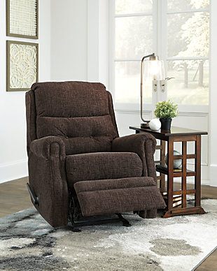 The chenille-textured Penzberg recliner grants you the resting power you deserve. Refined sizing saves space without sacrificing comfort. With just one pull, it reclines to the position of your liking. And talk about style. Gorgeous brown hue is accompanied by slim arms and button tufting on the lumbar cushion.One pull reclining motion | Corner-blocked frame with metal reinforced seat | High-resiliency foam cushion wrapped in thick poly fiber | Polyester upholstery