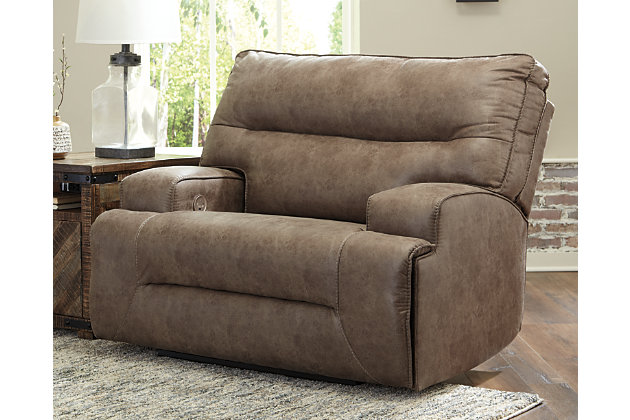 For those that love the cool look of leather but long for the warm feel of fabric, the Hazenburg zero wall power recliner delivers both with ease. Its high-performance padded faux leather is remarkably durable and easy to clean, just the thing for family spaces. When it’s time to relax, the one-touch power control puts the perfect position at your fingertips. Channel-stitched back cushions provide indulgent lumbar support for maximum seating comfort—not to mention fashion-forward flair.One-touch power control with adjustable positions and USB plug-in | Corner-blocked frame with metal reinforced seat | Attached cushions | High-resiliency foam cushions wrapped in thick poly fiber | Polyester/polyurethane (faux leather) upholstery | Zero wall design requires minimal space between wall and chair back | Power cord included; UL Listed