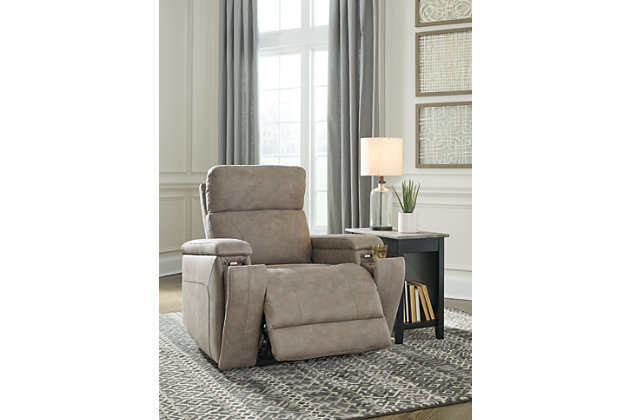 Inspired by luxury automotive interiors, the Rowlett power recliner is just where you want to be when it’s time to downshift for the day. Loaded with comfort and streamlined for high style, this decidedly modern power recliner in fashion-forward faux leather cradles you from head to toe. The one-touch power control puts comfort—and convenience—at your fingertips with features including an Easy View™ adjustable headrest, power lumbar support and zero draw USB plug-in for energy efficiency. And how’s this for a nice surprise: hidden cup holders (with magnetic locking system) to maximize the minimalism of this sleek recliner.One-touch power control with adjustable positions, Easy View™ adjustable headrest, power lumbar support and zero-draw USB plug-in | Zero-draw technology only consumes power when the USB receptacle is in use | Polyester/polyurethane upholstery | Corner-blocked frame with metal reinforced seat | Attached back and seat cushions | High-resiliency foam cushions wrapped in thick poly fiber | Hidden cup holders with magnetic locking | Extended ottoman for enhanced comfort | Power cord included; UL Listed