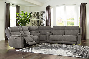 It’s time to rethink the way you relax—and time to experience the joys of this power reclining sectional. Taking a fashion-forward approach to the art of relaxation, the Next-Gen DuraPella sectional—with a one-touch power control and an energy-efficient USB plug-in—will elevate your style and raise your standard of living. Its zero-gravity mechanism lifts the ottoman higher than traditional recliners to improve circulation. And talk about low maintenance. This designer sectional is wrapped in durable, water-repellent upholstery that's family- and pet-friendly.Includes 3 pieces: power reclining loveseat, power reclining sofa and wedge | One-touch power control with adjustable positions, Easy View™ adjustable headrest and zero-draw USB plug-in | Zero-draw technology only consumes power when the USB receptacle is in use | Corner-blocked frame with metal reinforced seat | Attached back and seat cushions | High-resiliency foam cushions wrapped in thick poly fiber | Zero-gravity mechanism (raises the ottoman for improved circulation) | Extended ottoman for enhanced comfort | Water-repellent polyester/polyurethane (faux leather) upholstery | Power cord included; UL Listed | Estimated Assembly Time: 55 Minutes