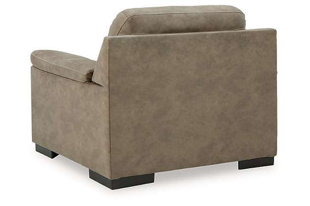 If you love the idea of a luxe look that won't break the bank, make yourself comfortable with the alluring light-hued Maderla chair in a neutral shade of pebble brown. Designed to look like the real thing, it's wrapped in a practical, easy-care faux leather loaded with natural tonal variation and a soft hand feel. Appealing to a contemporary taste, its jumbo stitching, tufted styling and pillow top armrests are indulgently comfortable, with a streamlined look that tops off the high-end aesthetic made for everyday living.  Corner-blocked frame | Attached back and seat cushions | High-resiliency foam cushions wrapped in thick poly fiber | Polyester/polyurethane upholstery | Jumbo stitching; tufted details | Flared pillow top arms | Exposed feet with faux wood finish | Platform foundation system resists sagging 3x better than spring system after 20,000 testing cycles by providing more even support | Smooth platform foundation maintains tight, wrinkle-free look without dips or sags that can occur over time with sinuous spring foundations