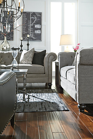 Classic Chesterfield tuxedo style is making a return, much to our pleasant surprise. And doesn’t the Ardenboro loveseat bring it back with newfound flair. A string of nailhead trim shows off the curves of the sumptuous rolled arms beautifully. Button tufted back with a deep diamond pattern is tailored to perfection.Corner-blocked frame | Attached back and reversible seat cushions | High-resiliency foam cushions wrapped in thick poly fiber | 2 decorative pillows included | Polyester upholstery; polyester/rayon and polyester toss pillows | Pillows with soft feather inserts; zippered access | Nailhead trim | Exposed feet with faux wood finish
